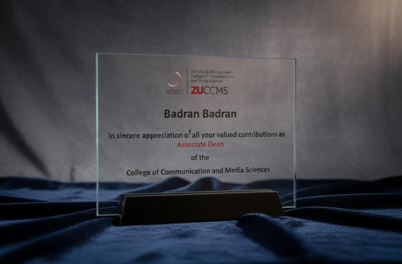 Glass plaque from ZU CCMS: in sincere appreciation of all your valued contributions as Associate Dean of the College of Communication and Media Sciences